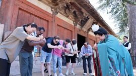 Guests on the “Discovering Shanxi’s Ancient Chinese Architecture” tour practice the Tang-style hand-over-chest salute at Foguang Temple in Xinzhou.