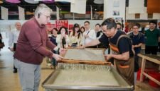 H.E. Mr. Karlis Eihenbaums，ambassador of Latvia to China, tries his hand at the traditional craft of Xuan papermaking.
